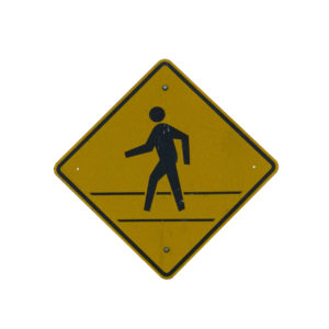 pedestrian crossing sign the helps prevent the need for a pedestrian accident attorney
