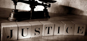 wooden blocks that spell justice