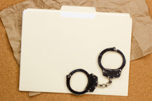 Handcuffs and Folder holding expunction of records petition
