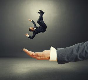 a slip and fall attorney can help you like this hand is catching a falling business man