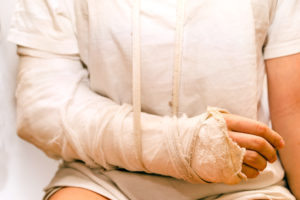 an injured person with arm bandaged 