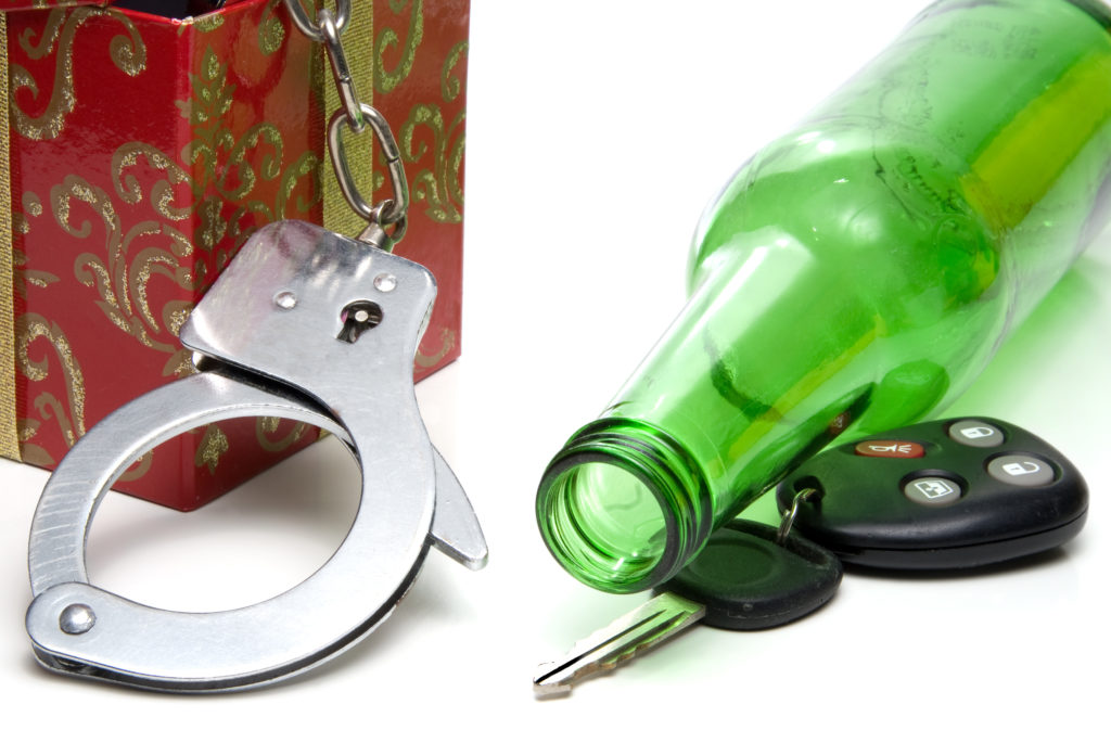 Car keys, beer bottle and a present of handcuffs.