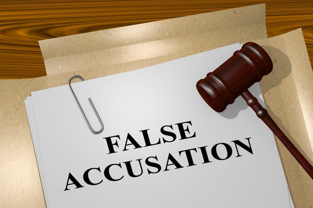 False Accusations with judge hammer and paperwork